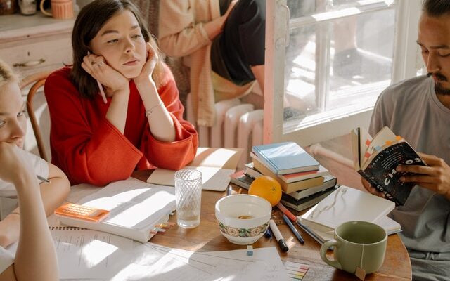 Three students at a table